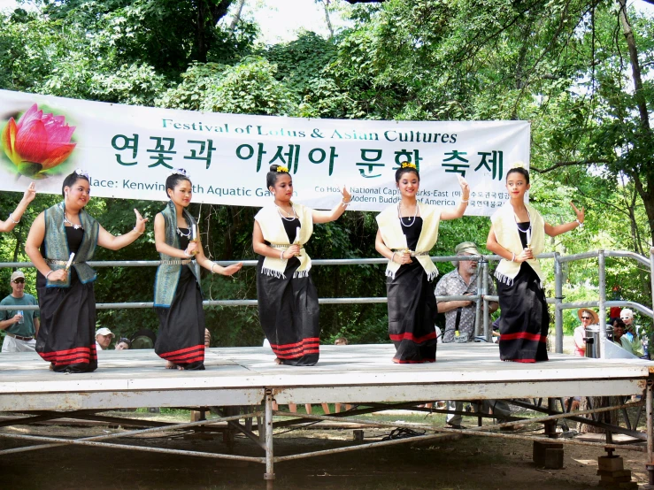 a group of young men perform a cultural dance