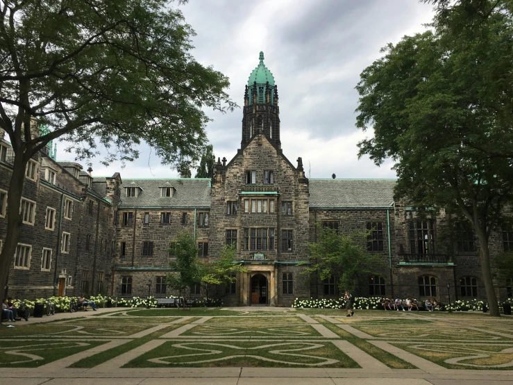 the courtyard at a university with a clock tower