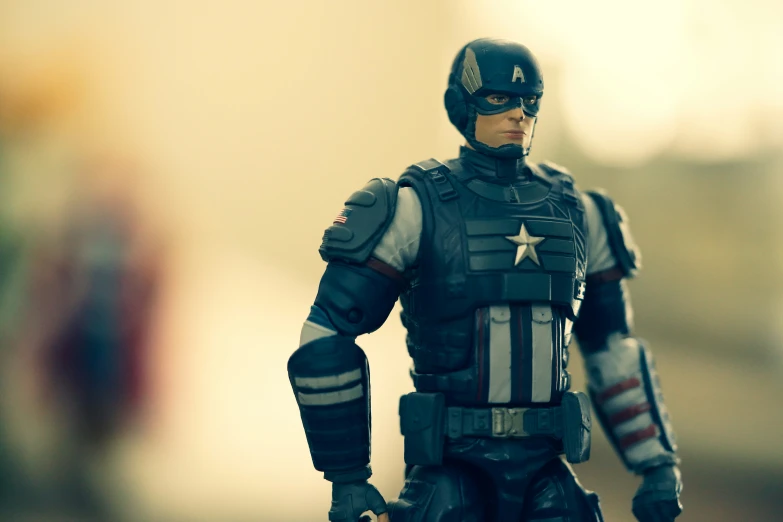 a toy captain america is posed for a pograph