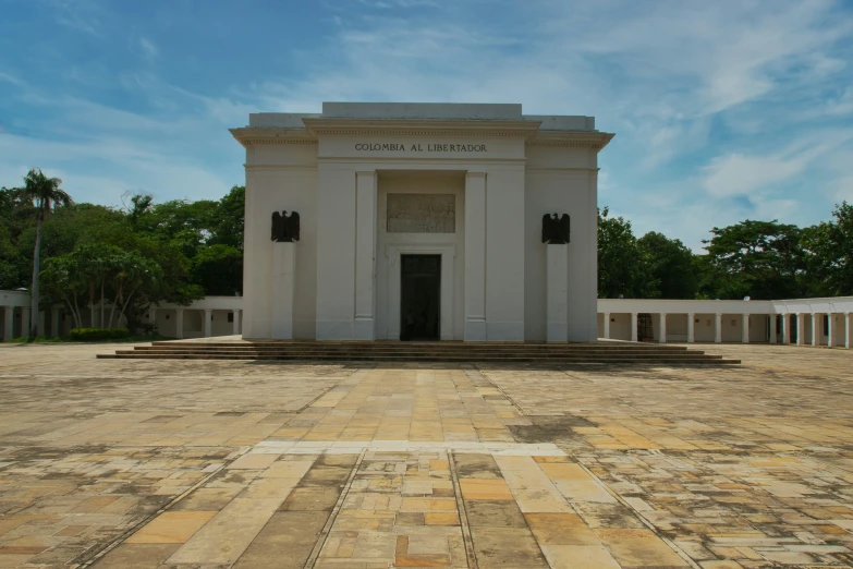 an architectural design monument with statues of two doors and four columns