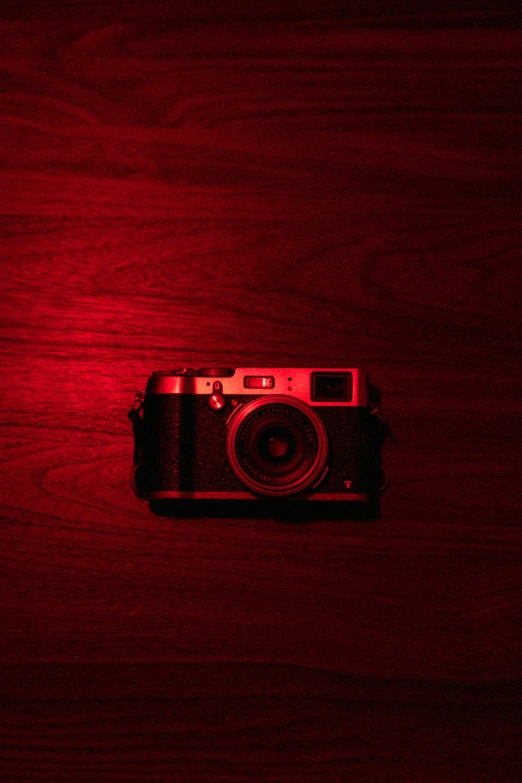 a camera sitting on top of a wooden table