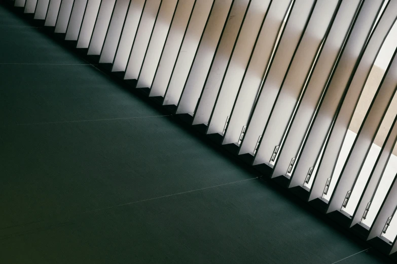 an angled window curtain on the outside of a building