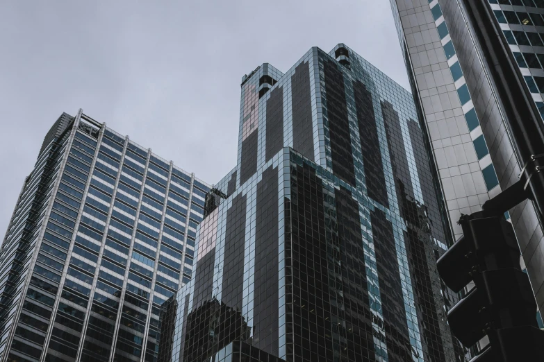 skyscrs on the corner of an intersection in a city