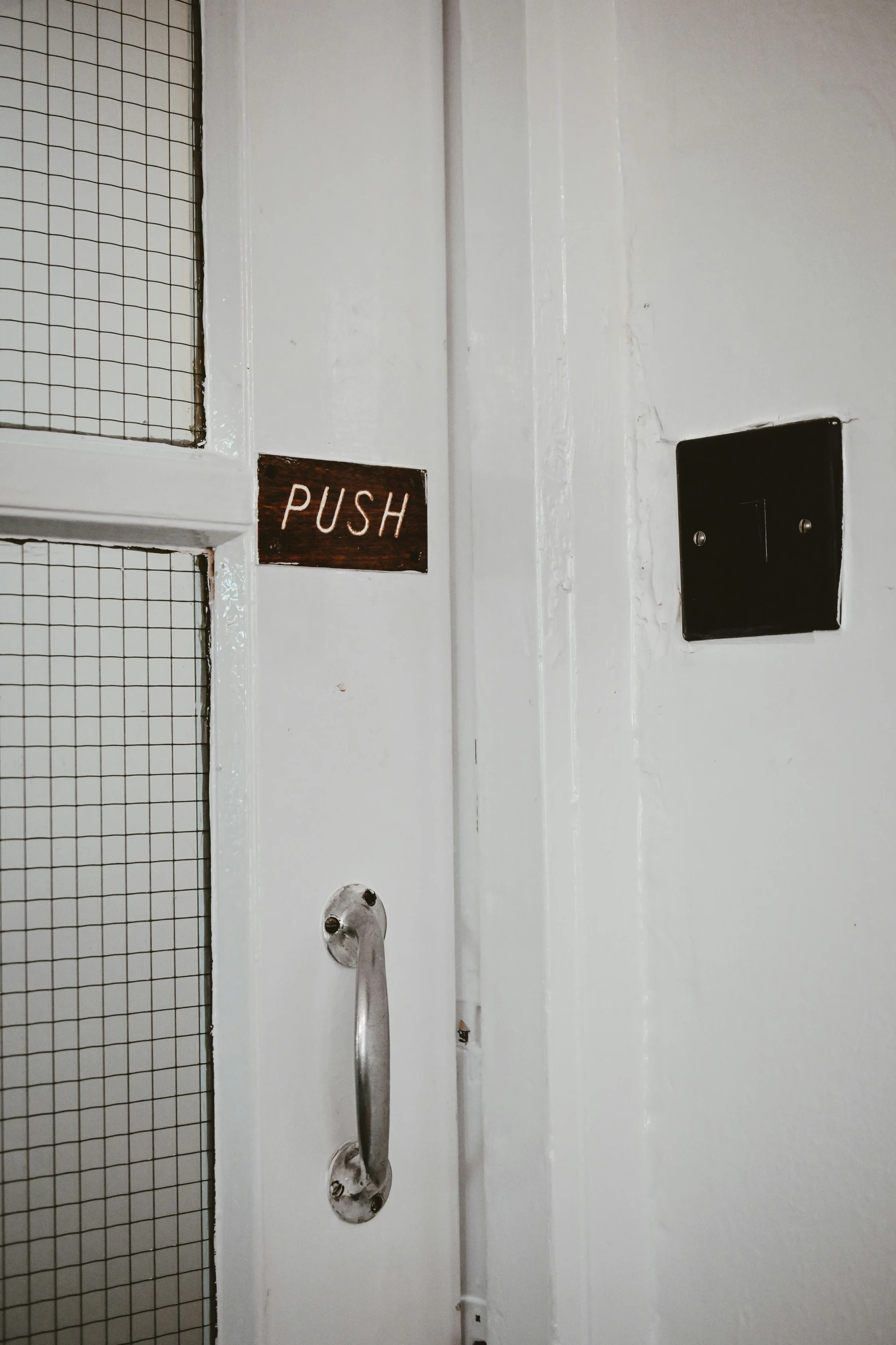 two doors with signs, two in front of them