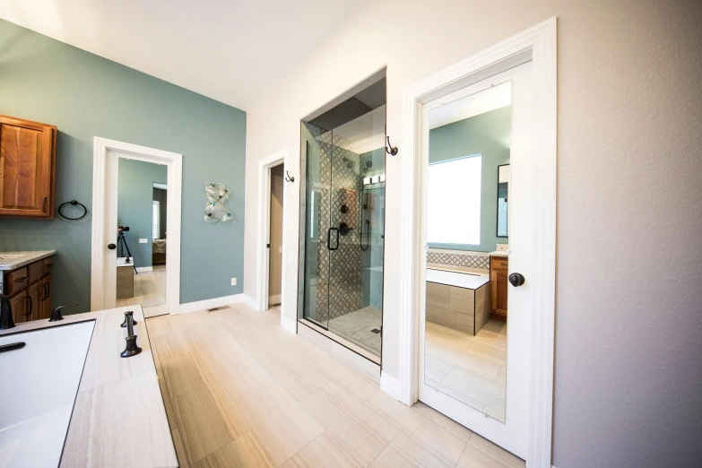 the large bathroom has a shower and separate vanity