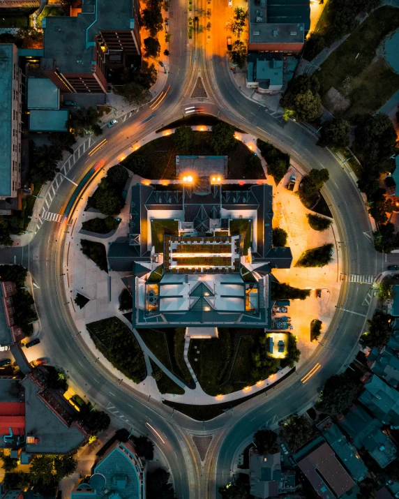 aerial view of various traffic on a curvy intersection at night