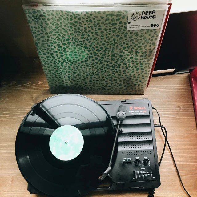 a record player and a radio laying next to a record player