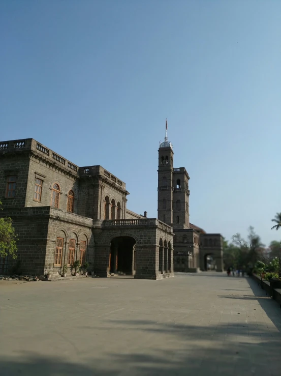 an old stone building with clock tower