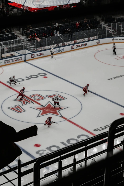 a hockey game is shown in the dark