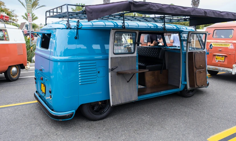 an old bus with open door with luggage