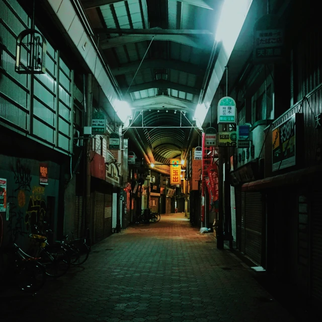 an underground area with benches and stores