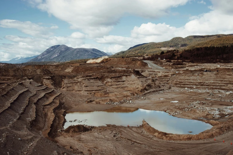 a view of some large muddy lakes on a hillside