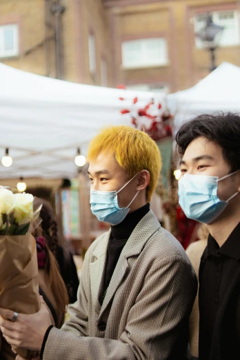 two men with face masks are at an event