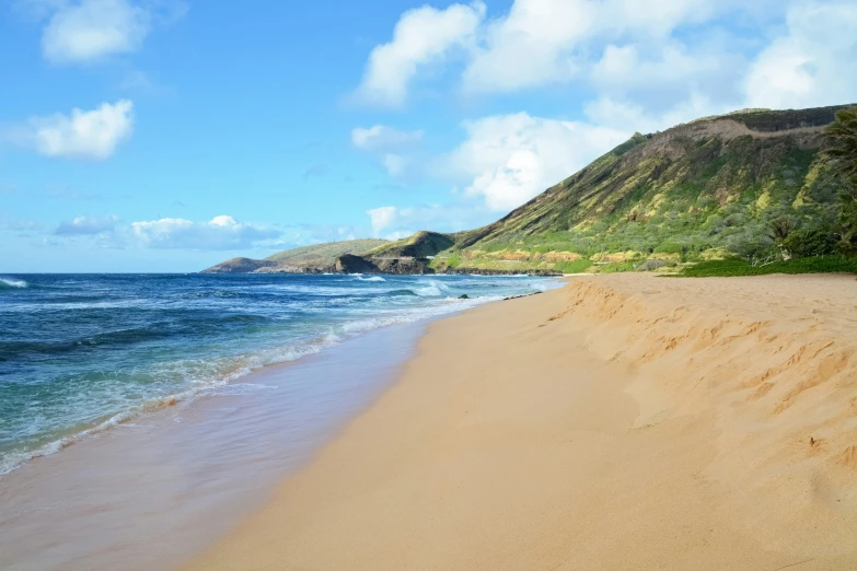 the shoreline of a beautiful island in the far distance