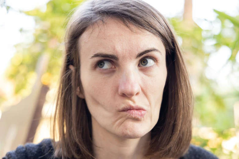 a close - up po of a woman with no eye makeup