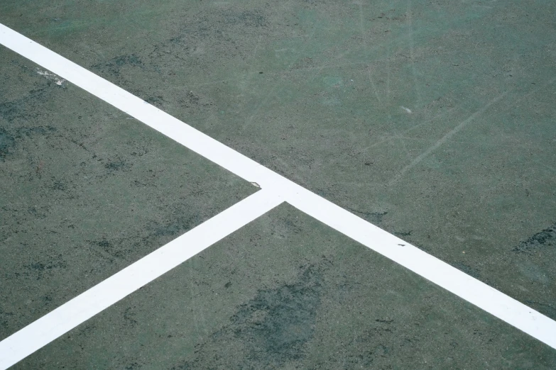 an overhead view of a tennis court showing the lines