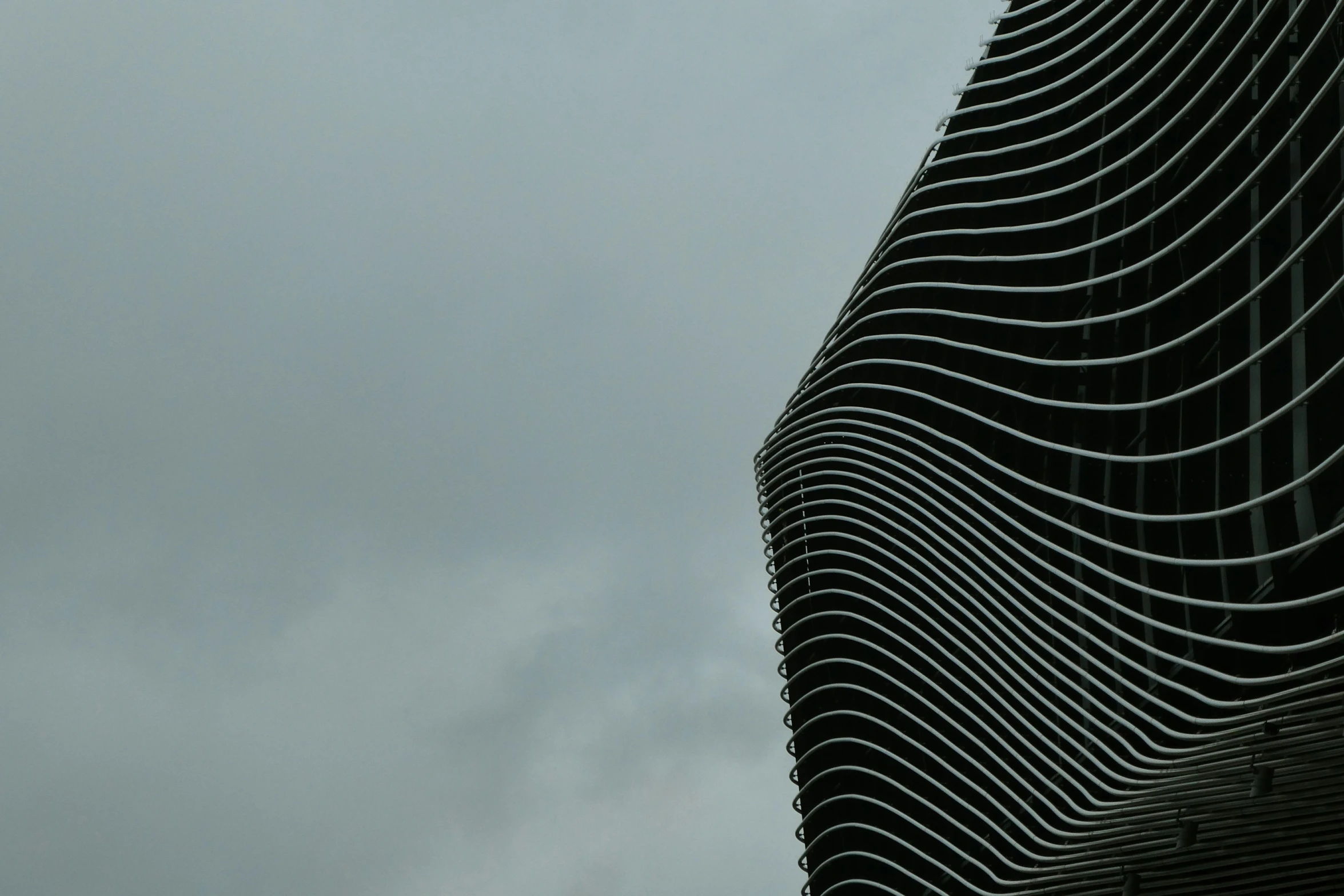 a very tall tower that is under some cloudy skies