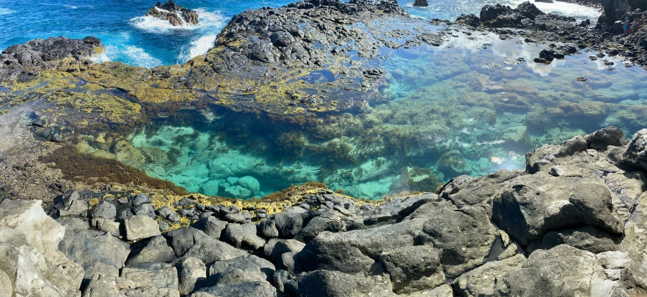 the rocks and water are visible in the water