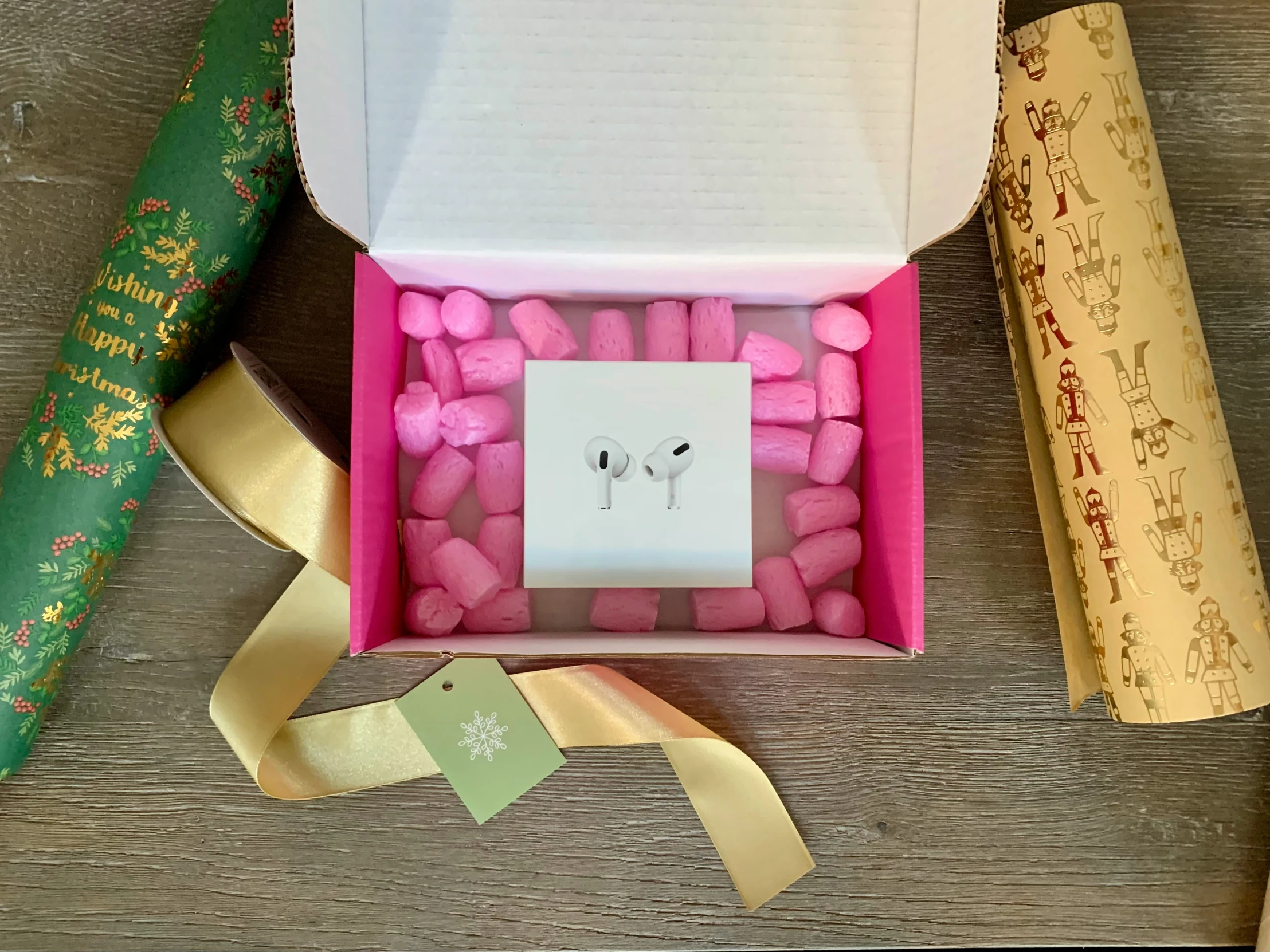 an open box of candles and ribbon on a table