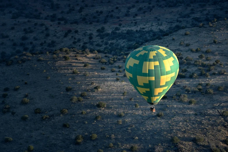 an odd looking  air balloon that is flying in the sky