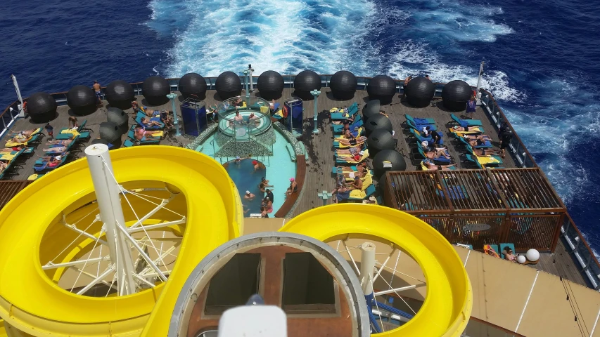 an overhead view of the decks on a ship with yellow rubber boats in it