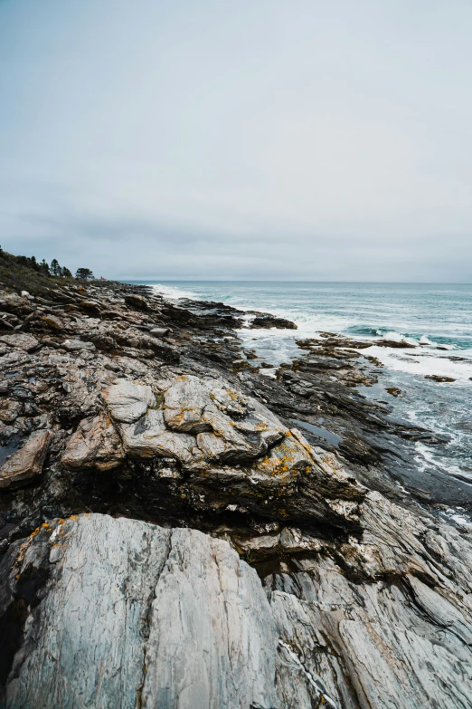 a lone person is standing on the shore line