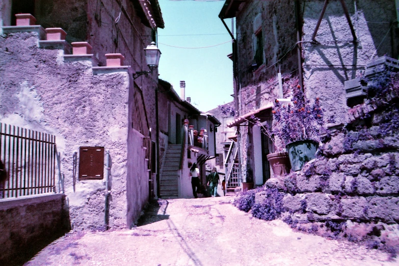 there is a street in an old city with houses