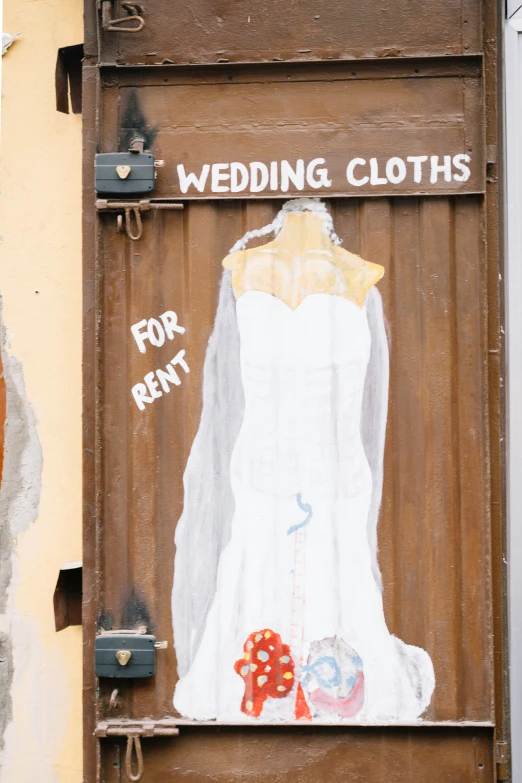 a painting of a bride wedding gown on a door