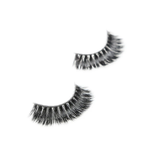 two eyelashes with long black lashes close up