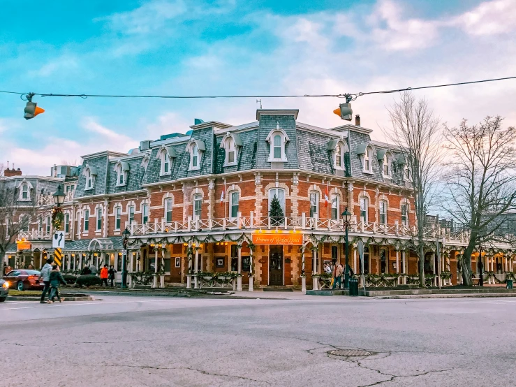 a street corner with the traffic lights on and the building in the background