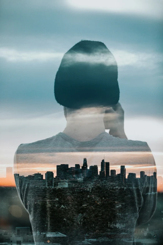 woman's reflection in the middle of a po looking into a city