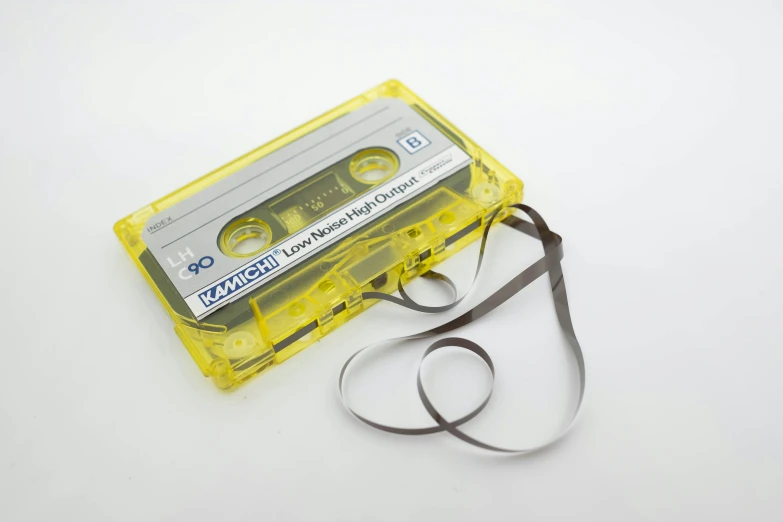 a tape cassette on top of a black leash