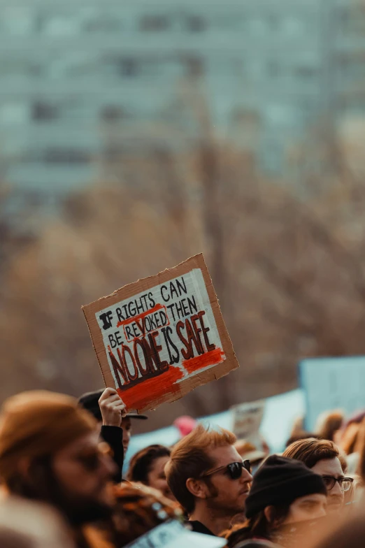 this is an image of people holding signs