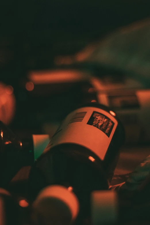 closeup of bottles of red wine sitting on the table