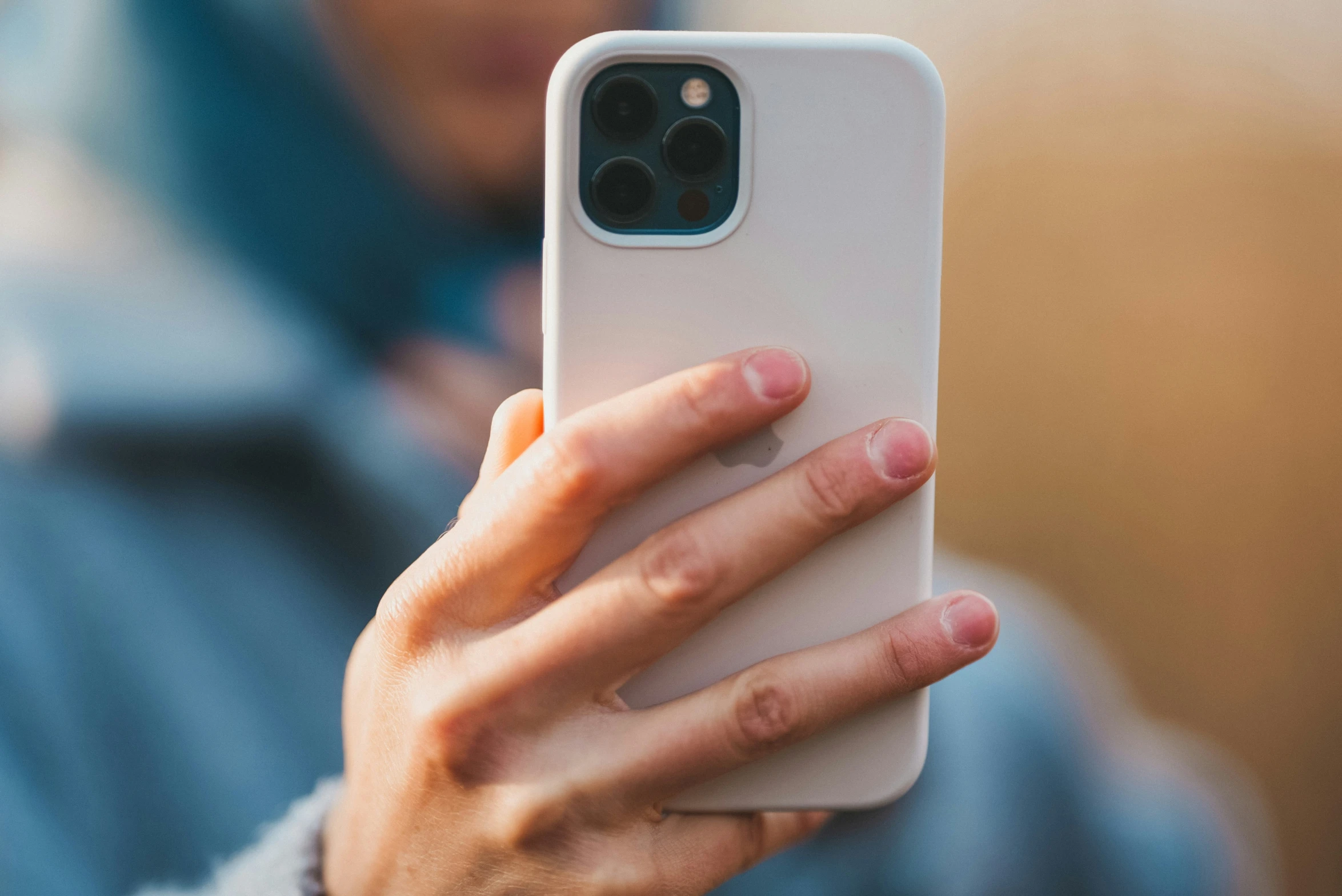 a person holding a camera in their hand