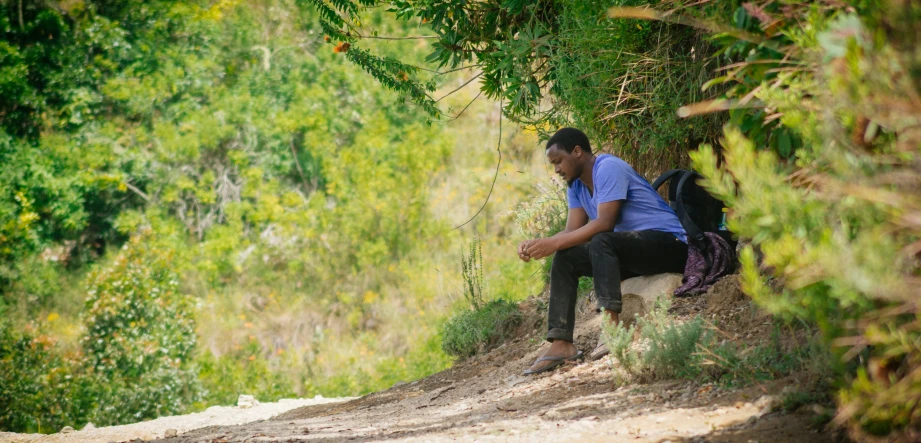 a person on a trail with a back pack