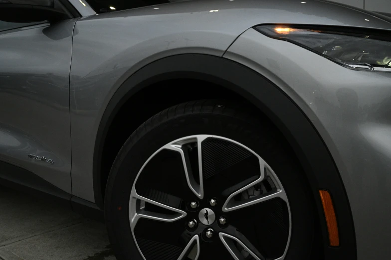 a close up view of the wheel spoke on a silver vehicle