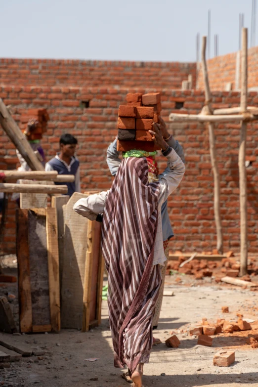 two people are on a street building brick