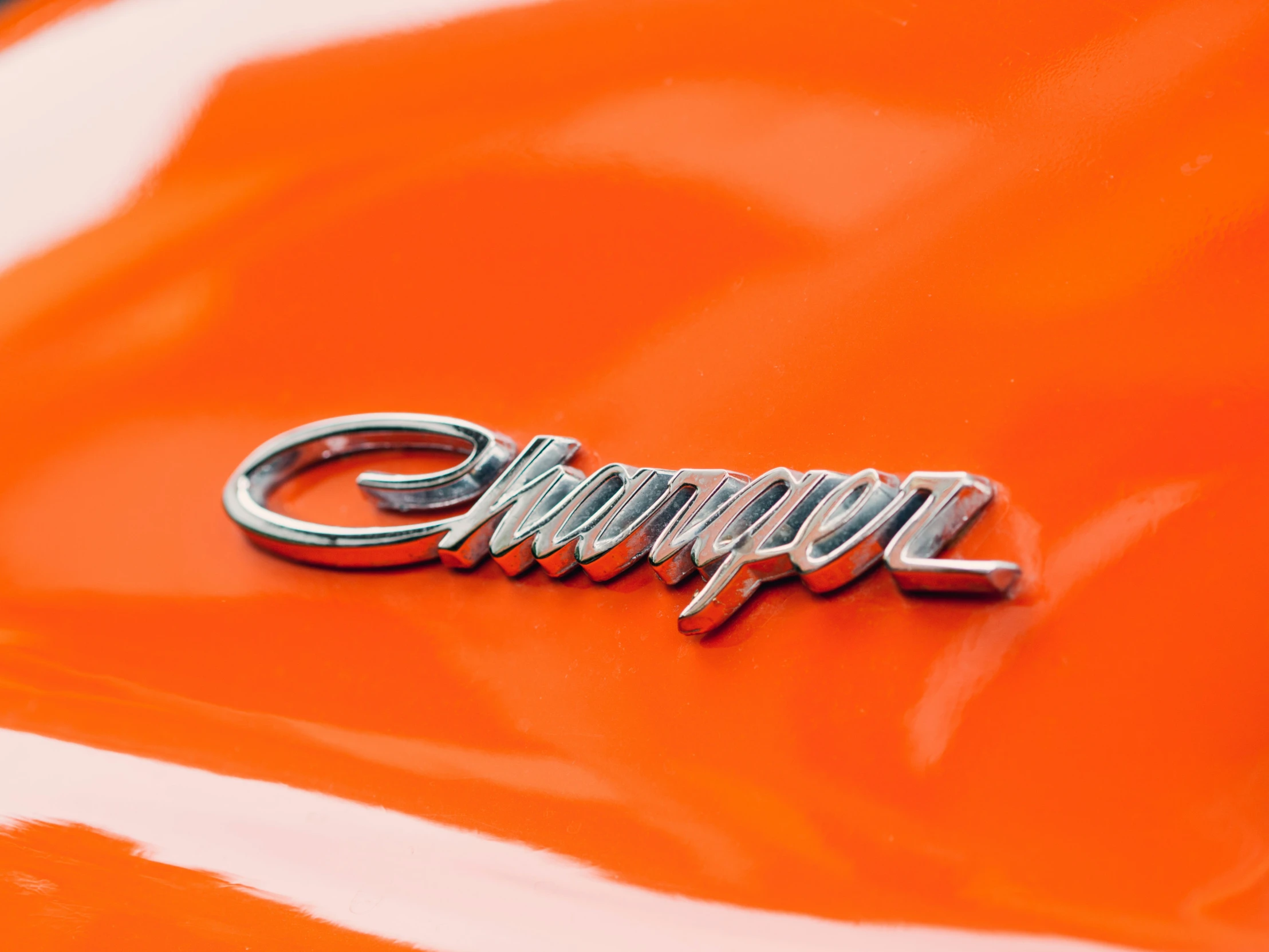 the nameplate on a car that is very shiny