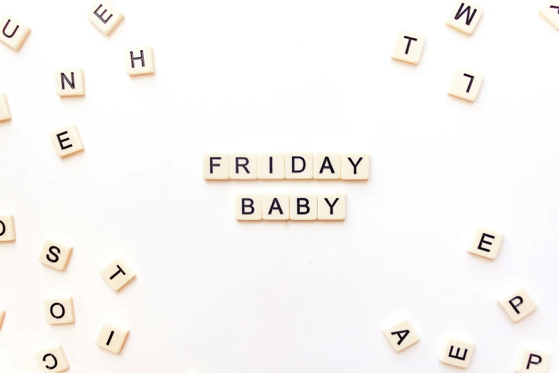 scrabble letters spelling the word friday baby