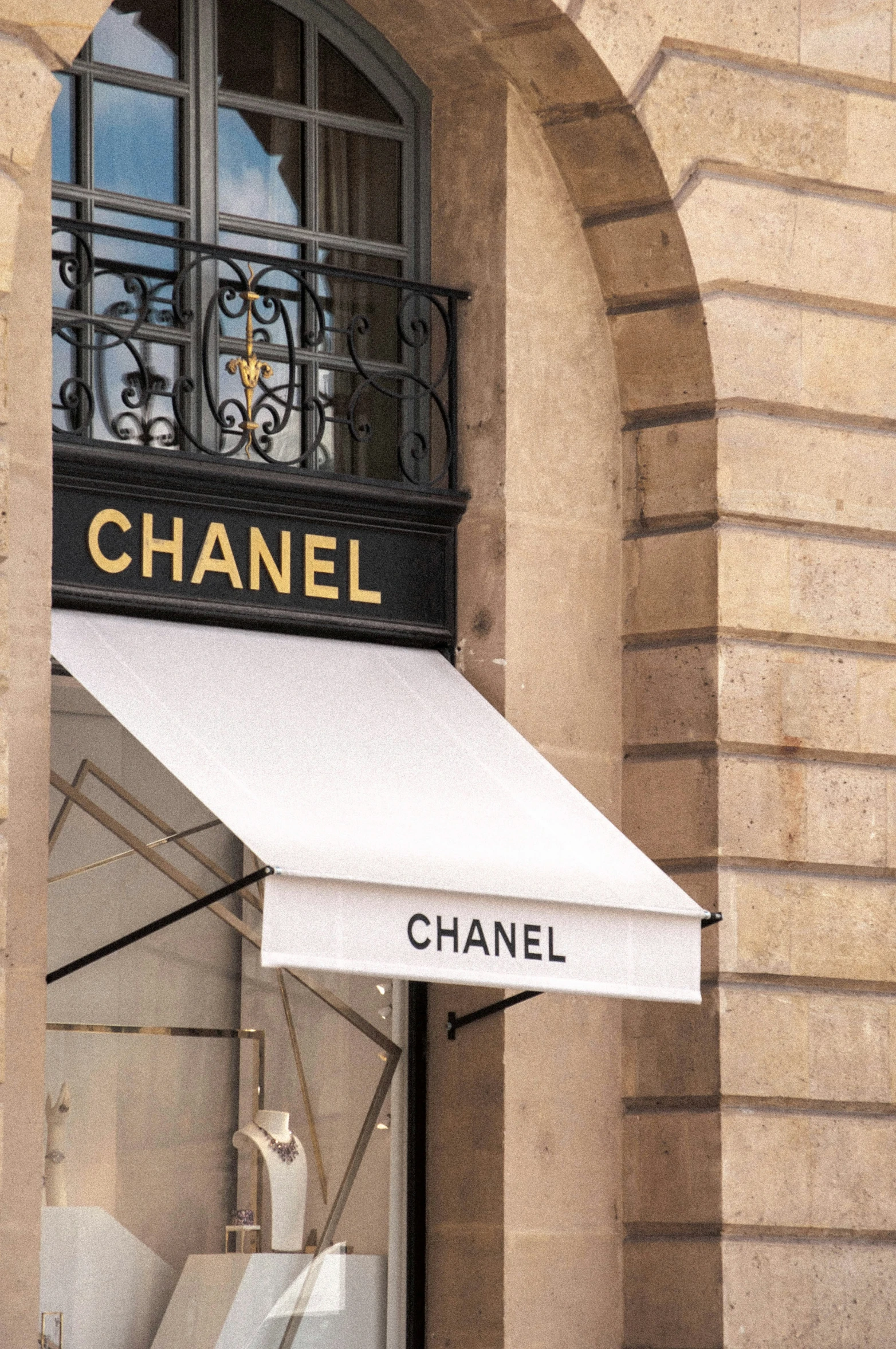 a view of the doorway and awning from underneath a chanel store