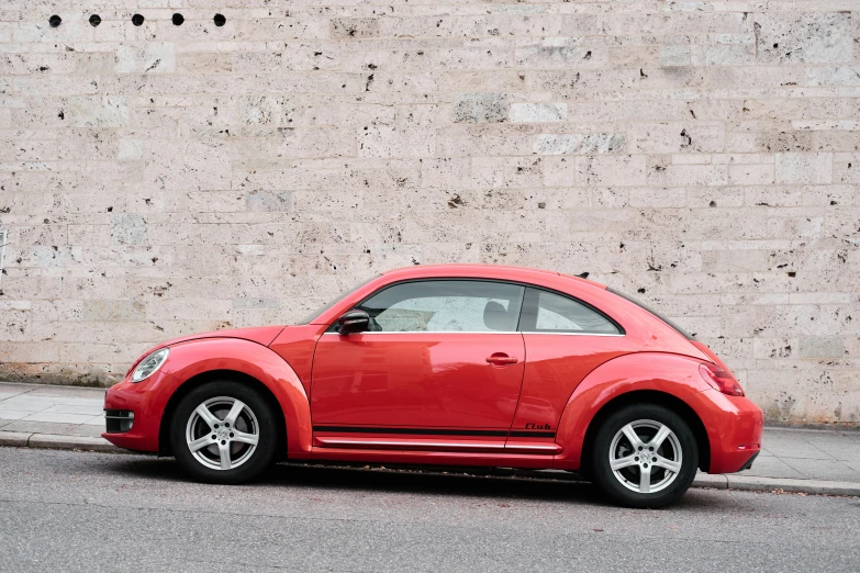 an electric beetle parked on the side of a road