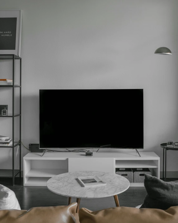 black and white pograph of living room with large television