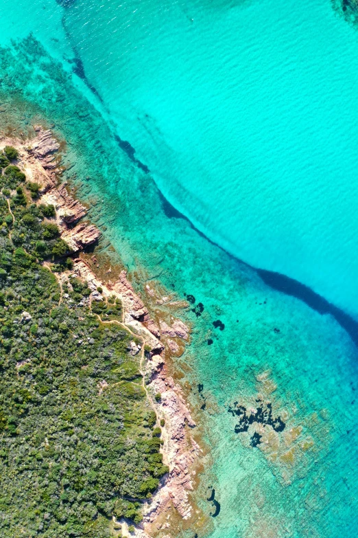 the ocean has blue water and some rocks