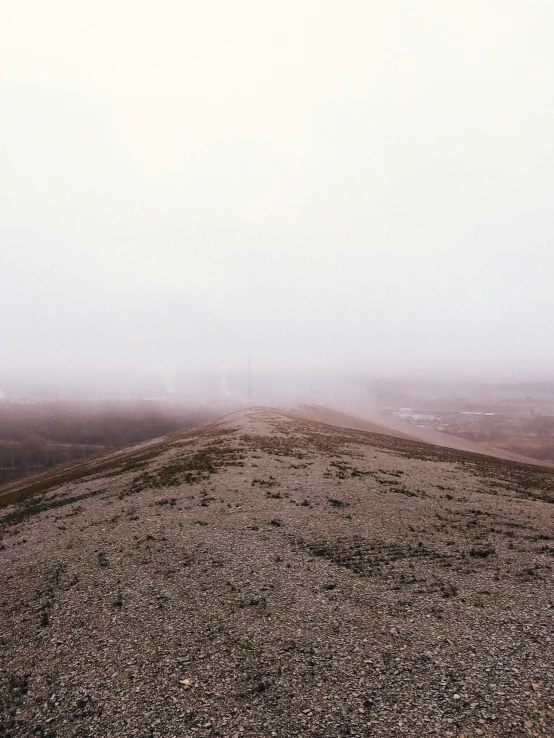 black and white pograph of fog in the distance