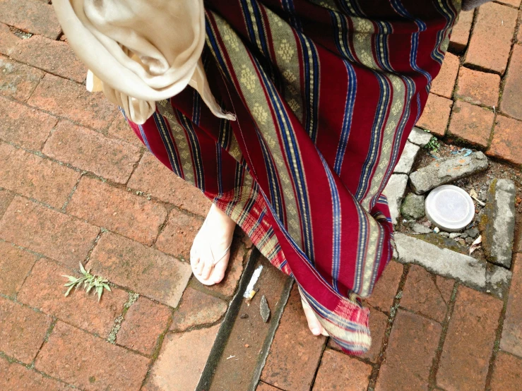 a woman standing next to an open umbrella