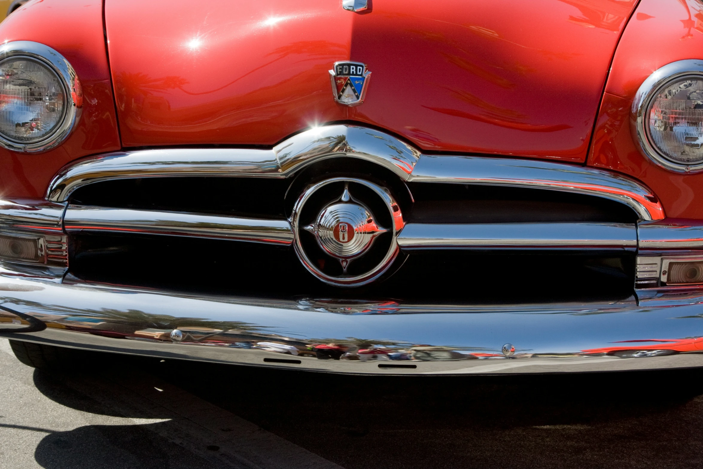 a close up of a classic american red car