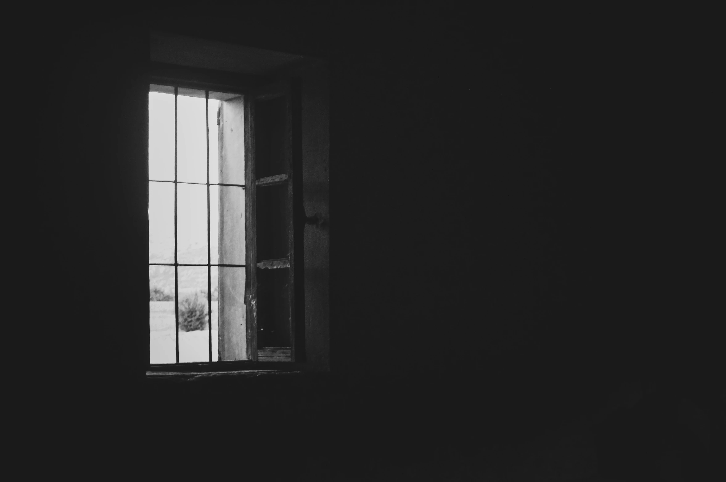 a black and white pograph of a window
