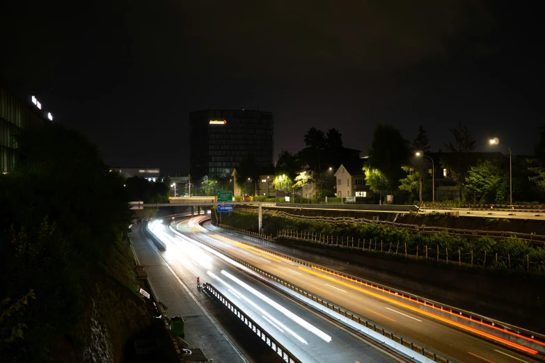 a highway is busy with light trails and cars