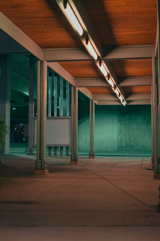 a empty covered outdoor area with benches and tables